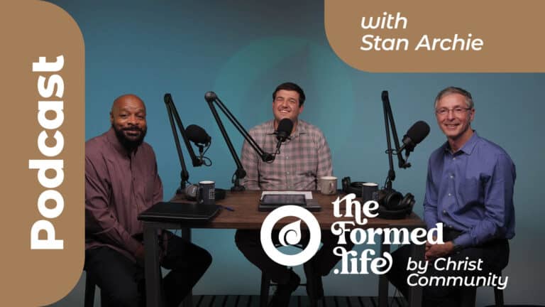 Stan Archie podcast featuring three men at a table with microphones.