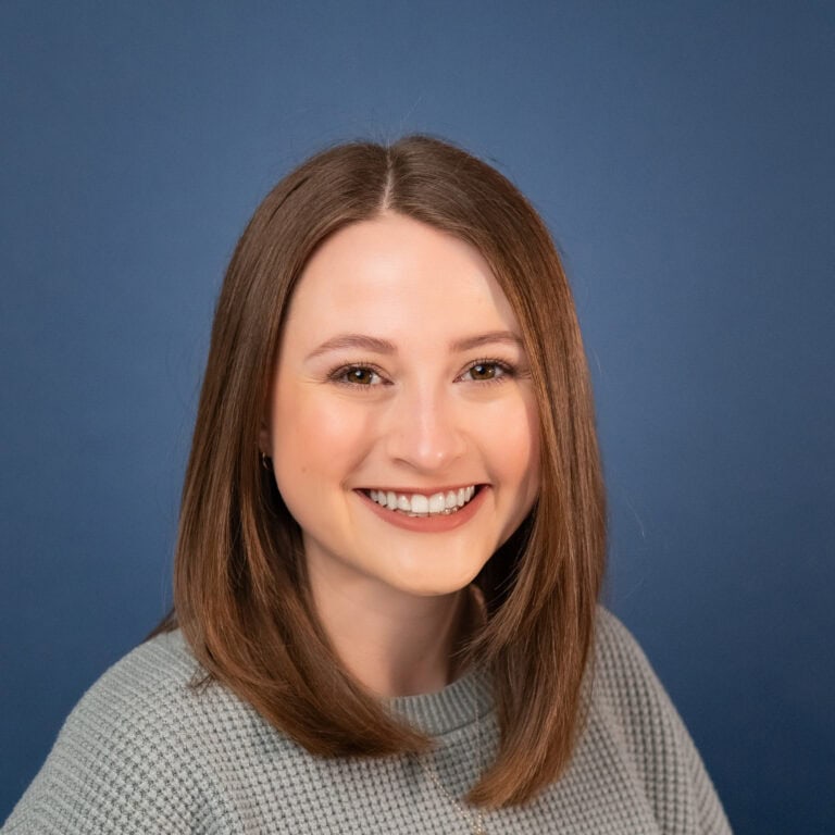 Amanda Stene portrait; smiling woman with shoulder-length brown hair