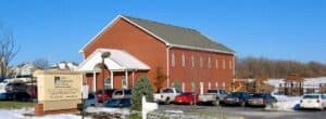 Christ Community Church Olathe Campus, a brick building with a sign.