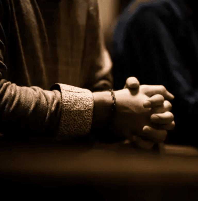 Hands clasped in prayer, reflecting on divine seeing and broadening prayer language.