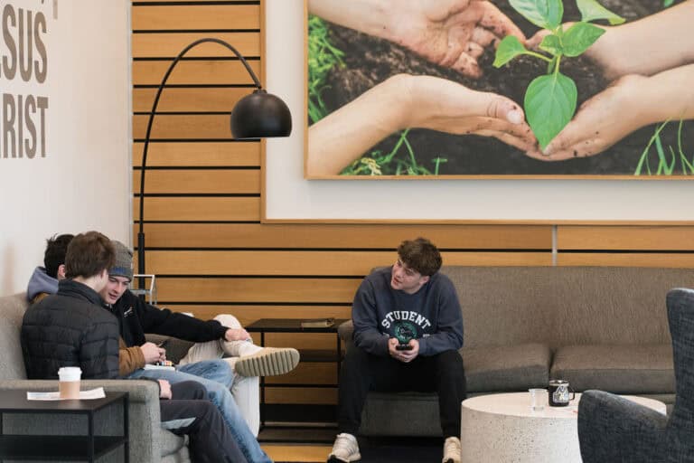 Students relax in the Shawnee Campus lobby at Christ Community Church.