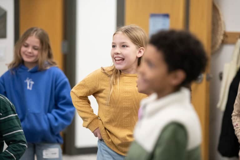 Kids smiling at Shawnee Campus. Children in a classroom setting.