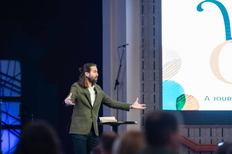 Pastor speaking at Christ Community Church, "A Journey